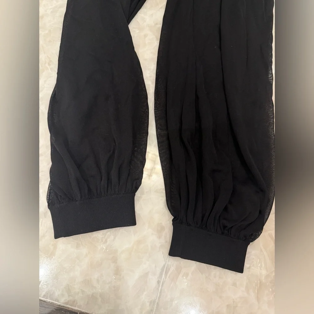 $3375 Alaia sheer peplum black balloon pants